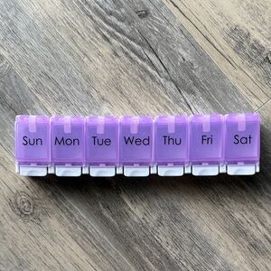 Weekly Pill Organizer with Purple Compartments. Cross Posted.